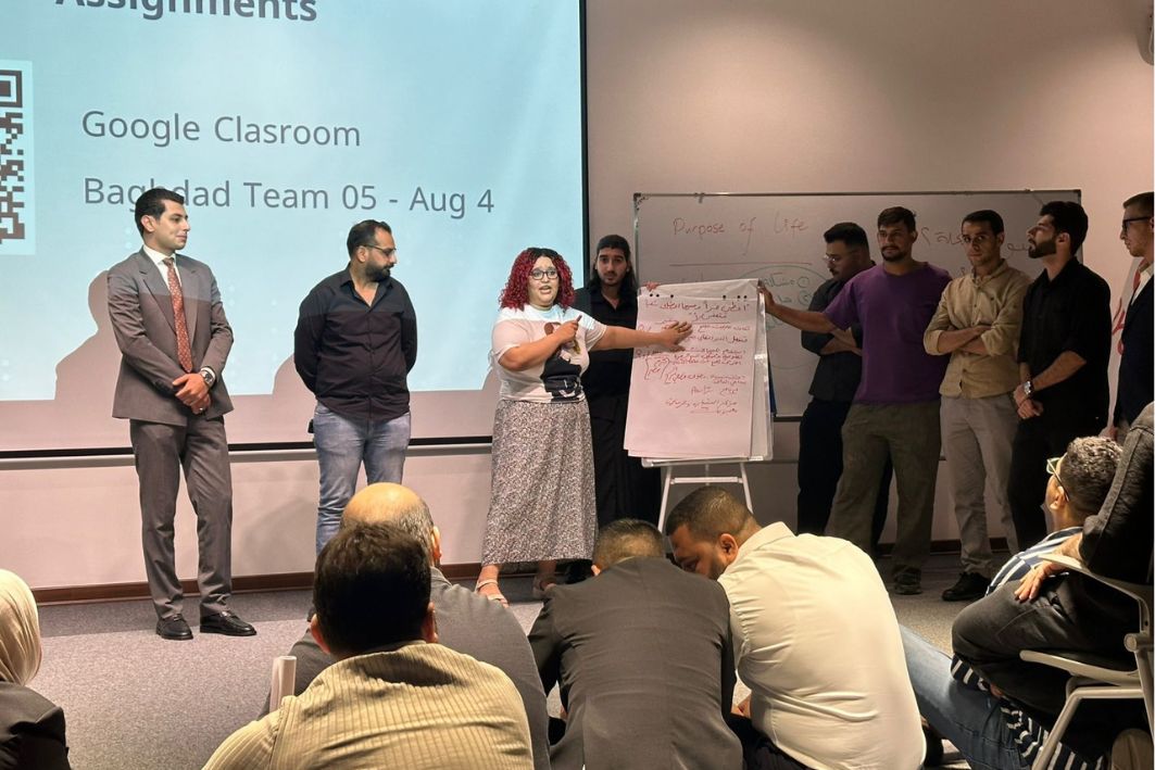 Young Iraqis presenting ideas at a bootcamp