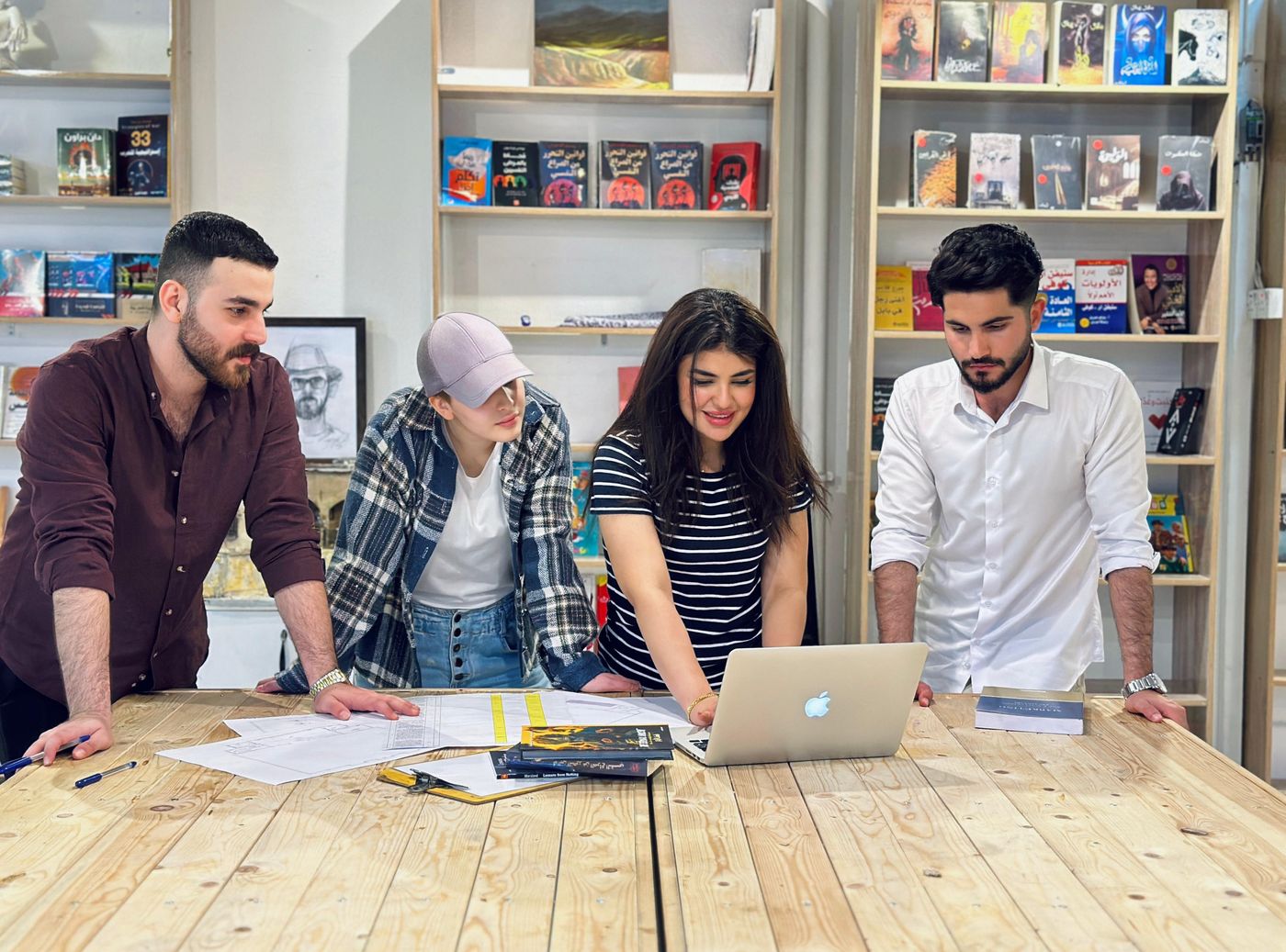 Team working together around a laptop