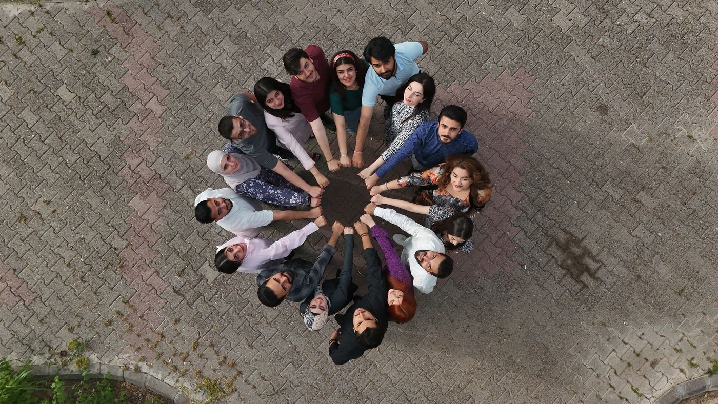 Youth standing in a circle, seen from above